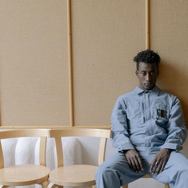 Person meditating in a calm, modern environment.